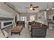 Open concept living room and dining area with vaulted ceiling and tile floors at 182 Santarem Cir, Punta Gorda, FL 33983