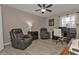 Comfortable living room with neutral tile, furniture, ceiling fan, and nice natural light at 182 Santarem Cir, Punta Gorda, FL 33983