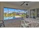 Charming screened patio provides a delightful setting to enjoy views of the private pool and landscaped yard at 182 Santarem Cir, Punta Gorda, FL 33983