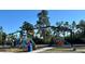 Community playground and picnic area with slides and swings at 182 Santarem Cir, Punta Gorda, FL 33983