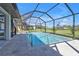 Relaxing screened-in pool with clear water and paved patio perfect for outdoor enjoyment at 182 Santarem Cir, Punta Gorda, FL 33983