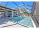 Backyard pool with a screened-in lanai, offering a perfect space for outdoor living and entertaining at 182 Santarem Cir, Punta Gorda, FL 33983