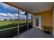 Screened patio with view of lush green space at 25623 Heritage Lake Blvd. # 57, Punta Gorda, FL 33983