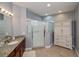Bathroom boasts a shower, granite vanity, and linen storage at 25623 Heritage Lake Blvd. # 57, Punta Gorda, FL 33983