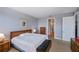 Main bedroom with king bed and ensuite bathroom access at 25623 Heritage Lake Blvd. # 57, Punta Gorda, FL 33983