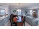 Elegant dining room with wood table and seating at 25623 Heritage Lake Blvd. # 57, Punta Gorda, FL 33983
