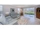 Spacious living room with gray sectional sofa and view at 25623 Heritage Lake Blvd. # 57, Punta Gorda, FL 33983