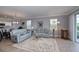 Light and airy living room with two sofas and a large rug at 25623 Heritage Lake Blvd. # 57, Punta Gorda, FL 33983