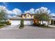 Tan two car garage with landscaping at 25623 Heritage Lake Blvd. # 57, Punta Gorda, FL 33983