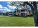 Exterior of building with community green space at 25623 Heritage Lake Blvd. # 57, Punta Gorda, FL 33983