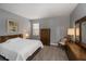 Bedroom with king bed, dresser, and window at 25623 Heritage Lake Blvd. # 57, Punta Gorda, FL 33983