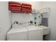 Laundry room with washer, dryer, and shelving at 25623 Heritage Lake Blvd. # 57, Punta Gorda, FL 33983
