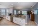 Modern white kitchen with granite countertops and stainless steel appliances at 25623 Heritage Lake Blvd. # 57, Punta Gorda, FL 33983
