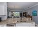 Kitchen features granite countertops, stainless steel appliances, and views at 25623 Heritage Lake Blvd. # 57, Punta Gorda, FL 33983