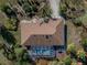 Top-down aerial view showcasing house, pool, and surrounding landscape at 28522 Coco Palm Dr, Punta Gorda, FL 33982
