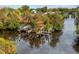 Waterfront property with private boat dock and lift reflecting on a tranquil canal waterway at 28522 Coco Palm Dr, Punta Gorda, FL 33982