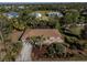 Aerial view of single-Gathering home with pool and lush landscaping at 28522 Coco Palm Dr, Punta Gorda, FL 33982