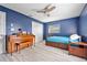 Bedroom with a piano, twin bed, and ceiling fan at 28522 Coco Palm Dr, Punta Gorda, FL 33982