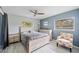 Charming bedroom with a ceiling fan and plenty of natural light at 28522 Coco Palm Dr, Punta Gorda, FL 33982