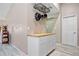 Additional kitchen area with hanging pot rack and butcher block counter at 28522 Coco Palm Dr, Punta Gorda, FL 33982