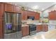 Updated kitchen boasts stainless steel appliances and rich wood cabinets at 28522 Coco Palm Dr, Punta Gorda, FL 33982