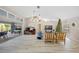 Spacious living room with high ceilings, hardwood floors, and a cozy seating area at 28522 Coco Palm Dr, Punta Gorda, FL 33982