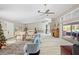 Open concept living room and dining area with high ceilings, hardwood floors, and lots of natural light at 28522 Coco Palm Dr, Punta Gorda, FL 33982