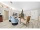 Bright and airy living room features a Christmas tree and comfortable seating at 28522 Coco Palm Dr, Punta Gorda, FL 33982