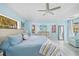 Serene main bedroom featuring light blue walls and a comfortable seating area at 28522 Coco Palm Dr, Punta Gorda, FL 33982