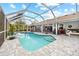 Resort-style pool with covered patio at 28522 Coco Palm Dr, Punta Gorda, FL 33982