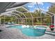 Enclosed pool and spa with patio area at 28522 Coco Palm Dr, Punta Gorda, FL 33982