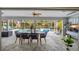 Outdoor dining area with pool and screened enclosure at 28522 Coco Palm Dr, Punta Gorda, FL 33982
