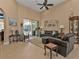 Relaxing living room with leather furniture and a ceiling fan at 2856 Mill Creek Rd, Port Charlotte, FL 33953