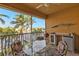 Spacious screened balcony overlooking the water; features a grill and mini-fridge at 3216 Purple Martin Dr # 122, Punta Gorda, FL 33950