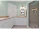 Elegant bathroom with double sinks, corner cabinet, and shower at 3216 Purple Martin Dr # 122, Punta Gorda, FL 33950
