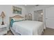 Serene bedroom with a queen bed and ensuite bathroom access at 3216 Purple Martin Dr # 122, Punta Gorda, FL 33950