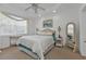 Comfortable bedroom with a queen bed and window with blinds at 3216 Purple Martin Dr # 122, Punta Gorda, FL 33950