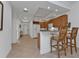 Well-equipped kitchen with granite counters and wood cabinets at 3216 Purple Martin Dr # 122, Punta Gorda, FL 33950