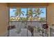 Spacious lanai with water views, outdoor table, and grill at 3216 Purple Martin Dr # 122, Punta Gorda, FL 33950