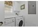 Convenient laundry room with washer and dryer, plus extra storage at 3216 Purple Martin Dr # 122, Punta Gorda, FL 33950