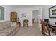 Home office with a sofa, desk, and view into adjacent dining area at 3216 Purple Martin Dr # 122, Punta Gorda, FL 33950
