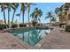 Community pool and spa with brick pavers at 3216 Purple Martin Dr # 122, Punta Gorda, FL 33950