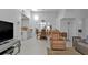 Relaxing living room featuring a recliner and view into dining area at 3300 Loveland Blvd # 1604, Punta Gorda, FL 33980