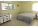 Bedroom with double bed, dresser, and window at 336 Orduna Dr, North Port, FL 34287