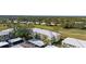 Aerial view of condo building near golf course at 433 Cerromar Ln # 441, Venice, FL 34293