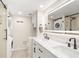 Modern bathroom with double vanity, walk-in shower, and laundry area at 433 Cerromar Ln # 441, Venice, FL 34293