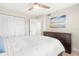 Bedroom with ceiling fan, dresser, and closet doors at 433 Cerromar Ln # 441, Venice, FL 34293