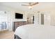Spacious Primary bedroom with king-size bed and access to the balcony at 433 Cerromar Ln # 441, Venice, FL 34293
