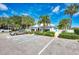 Community clubhouse with parking and lush landscaping at 433 Cerromar Ln # 441, Venice, FL 34293