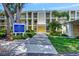 Building exterior with parking and landscaping at 433 Cerromar Ln # 441, Venice, FL 34293